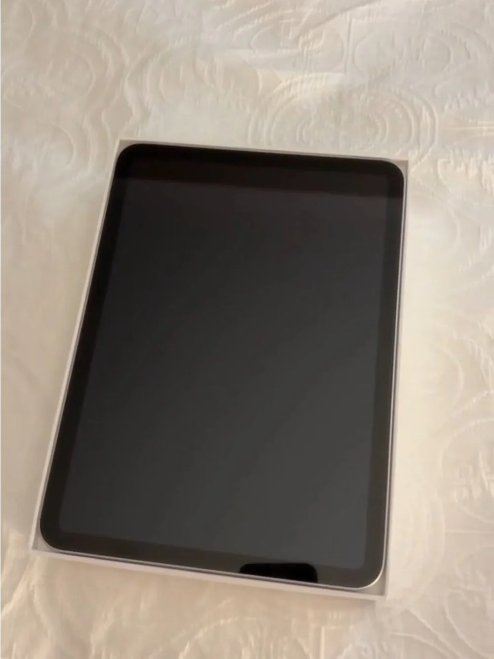 Apple Silver Tablet with Rear Camera and Apple Logo